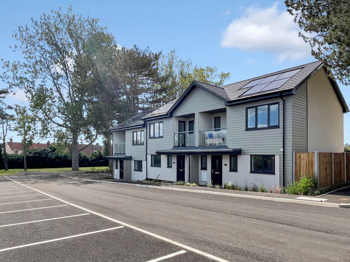 The Cedar - homes 33 - 35 for sale in Hemsby | Exterior view in the day with parking spaces in front